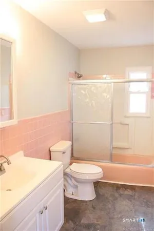 a bathroom with a toilet a sink and a bathtub