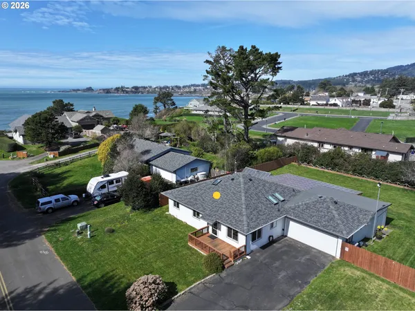 an aerial view of a house with outdoor space and street view