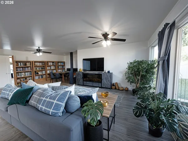 a living room with furniture and a large window