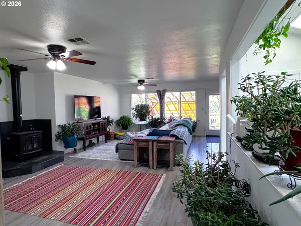 a bedroom with furniture and a flat screen tv