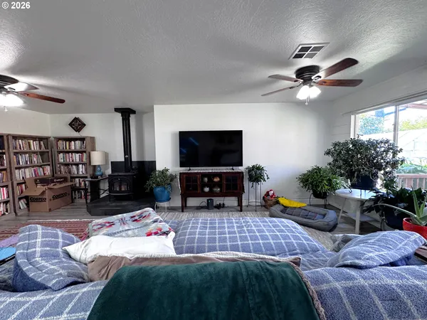 a kitchen with stainless steel appliances granite countertop a sink dishwasher stove and cabinets