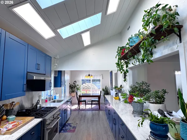 a view of a workspace and a window in a room