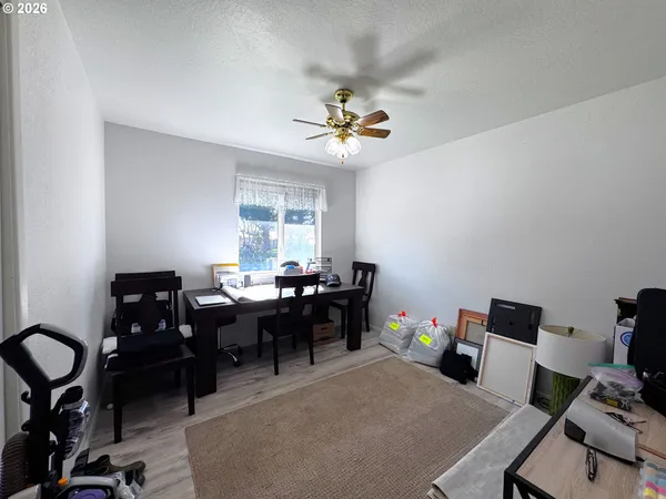 a view of a porch with furniture and a roof