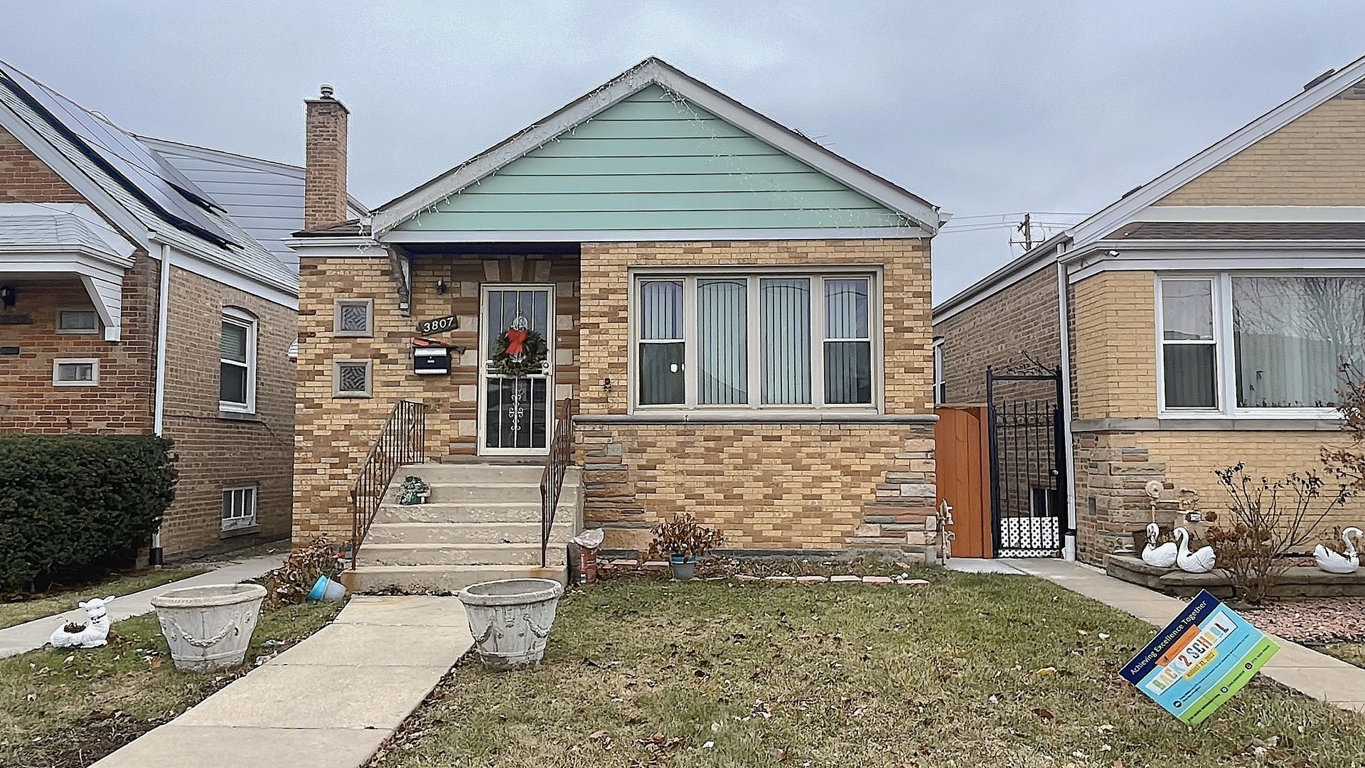 Undisclosed Address Chicago, IL 60629 - Photo 1 of 18 a front view of a house with garden
