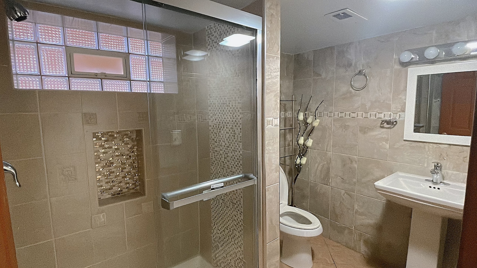 Undisclosed Address Chicago, IL 60629 - Photo 11 of 18 a bathroom with a granite countertop toilet a sink and shower