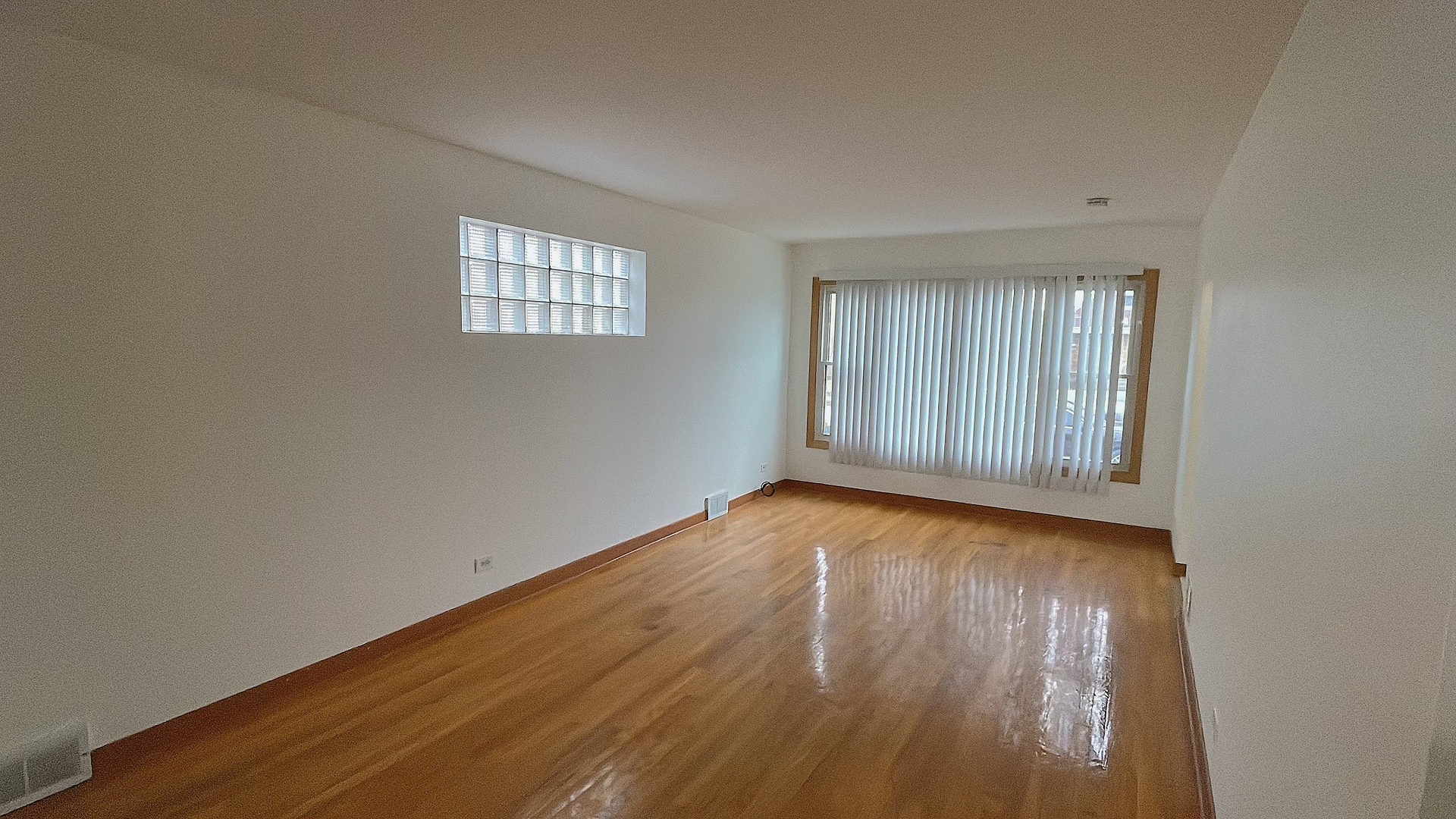 Undisclosed Address Chicago, IL 60629 - Photo 3 of 18 an empty room with wooden floor and windows