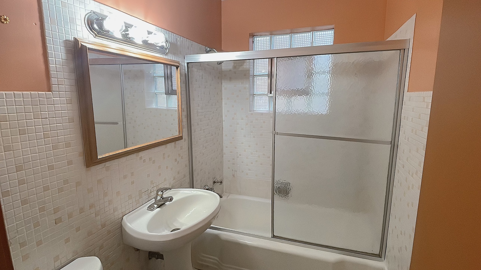 Undisclosed Address Chicago, IL 60629 - Photo 8 of 18 a bathroom with a shower and a sink