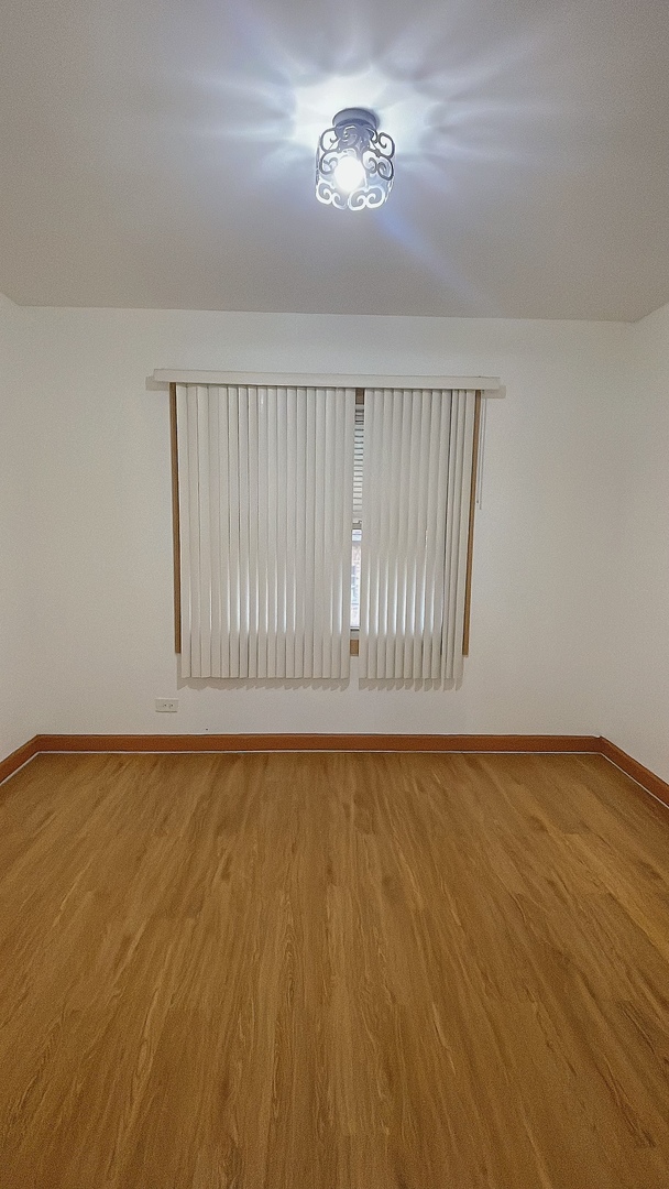 Undisclosed Address Chicago, IL 60629 - Photo 9 of 18 a view of an empty room with a window