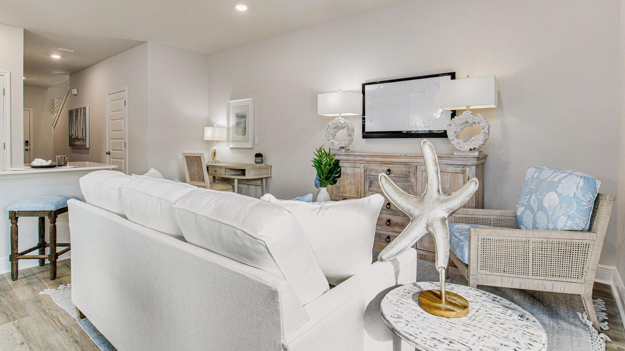 329 Callie Drive Crestview, FL 32536 - Photo 8 of 27 a living room with furniture and a flat screen tv