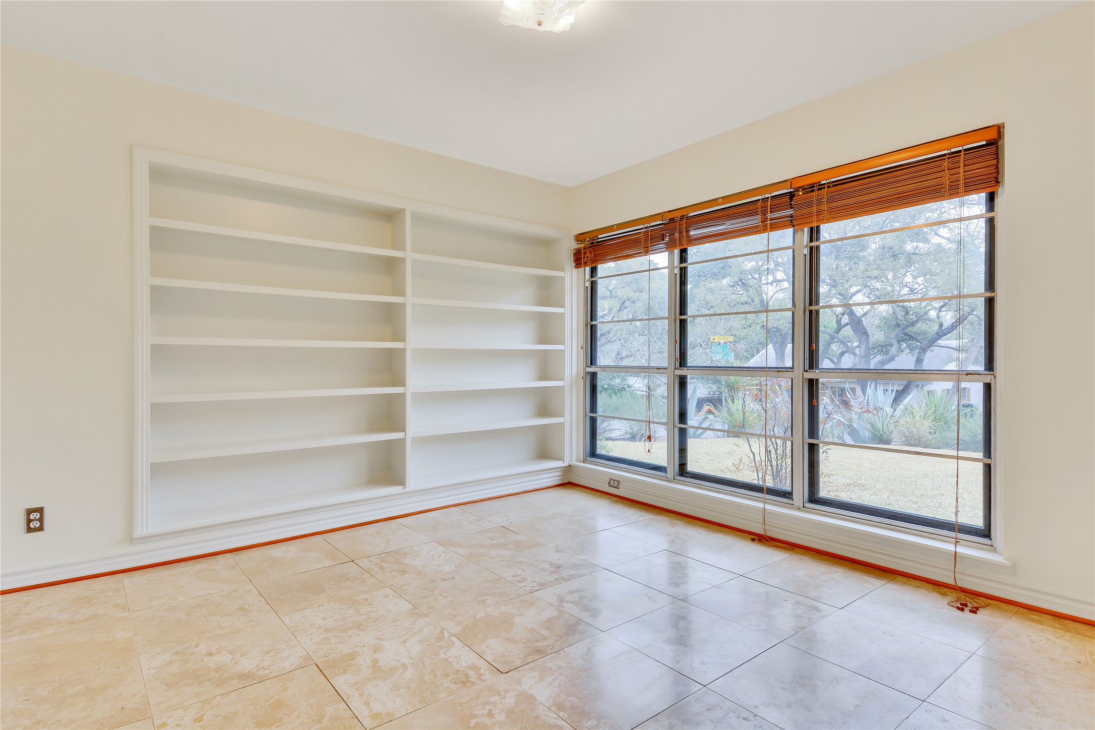 2300 Rebel Road Austin, TX 78704 - Photo 6 of 26 Built-in shelving provides ample storage in this flexible living space.