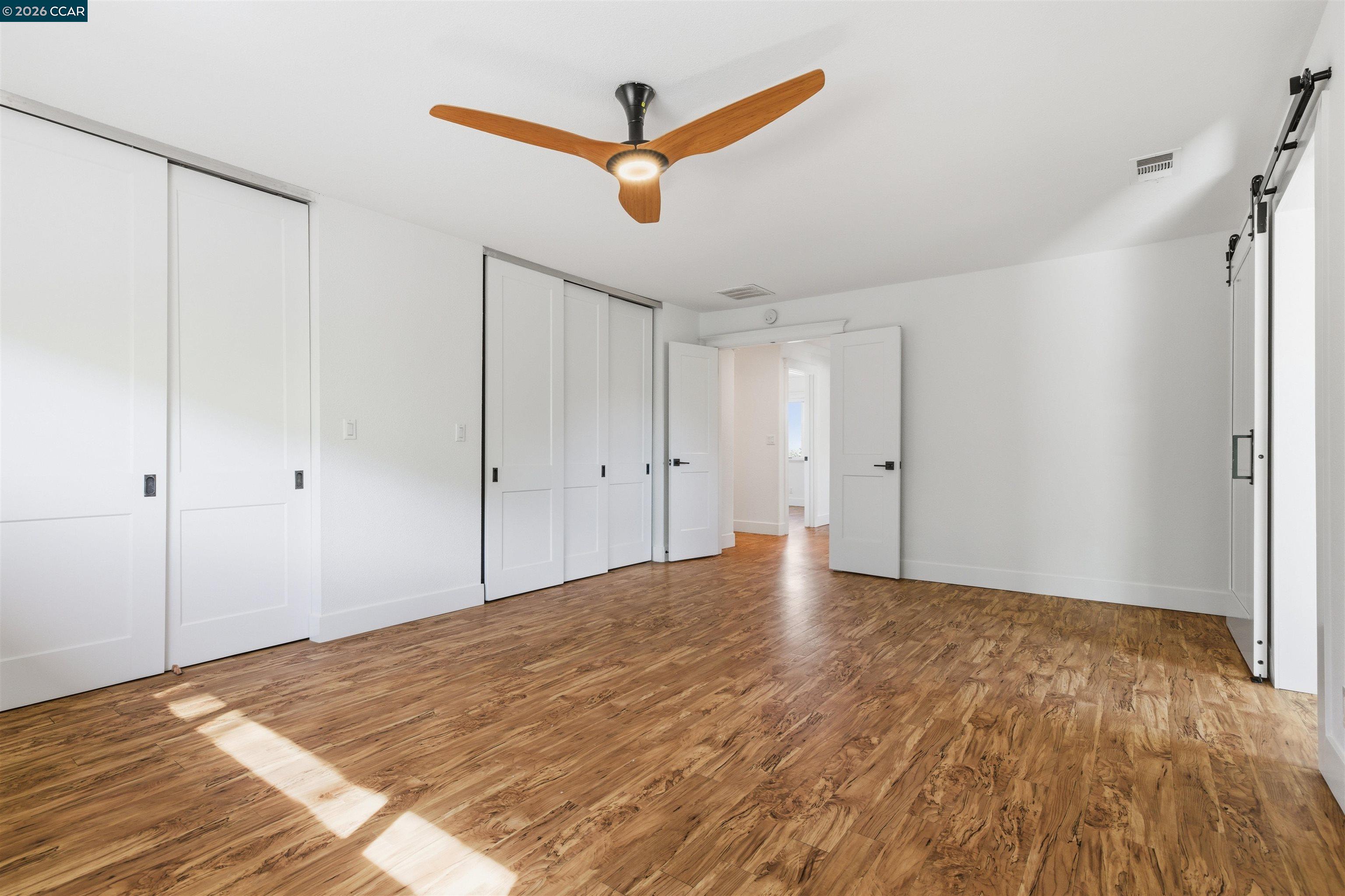 9530 Morgan Territory Road Livermore, CA 94551 - Photo 19 of 55 a view of empty room with wooden floor