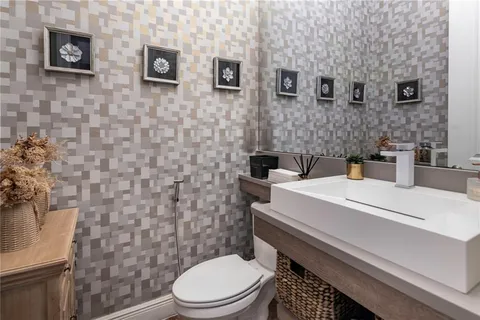 a living room with a couch and a chandelier