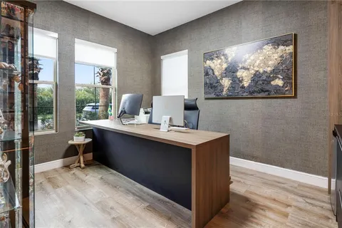 a bathroom with a shower sink vanity and toilet
