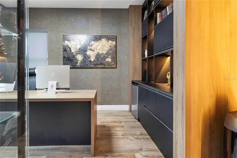 a bedroom with a bed and a table in it