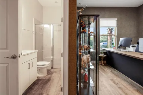 a view of a storage and utility room with washer and dryer