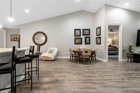 a living room with furniture and a clock