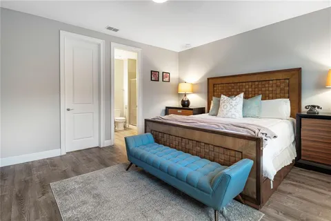 a view of swimming pool with chairs and tables in the patio