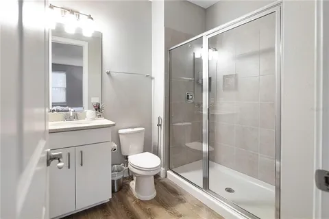 a view of a patio with table and chairs potted plants and palm tree