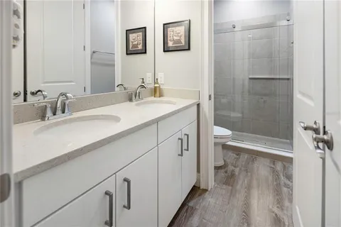 a view of a house with a yard and sitting area