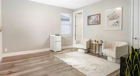 an aerial view of a house with a yard and lake view