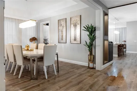 a view of a dining room with furniture and window