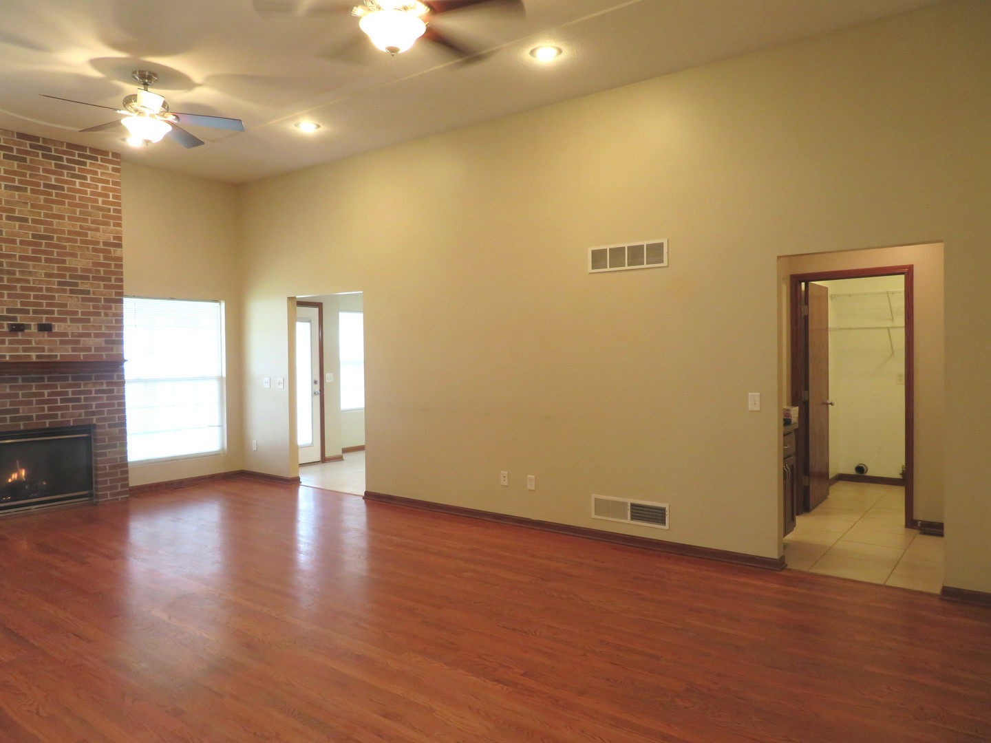 2044 Locust Road Morris, IL 60450 - Photo 8 of 30 a view of an empty room with window and wooden floor