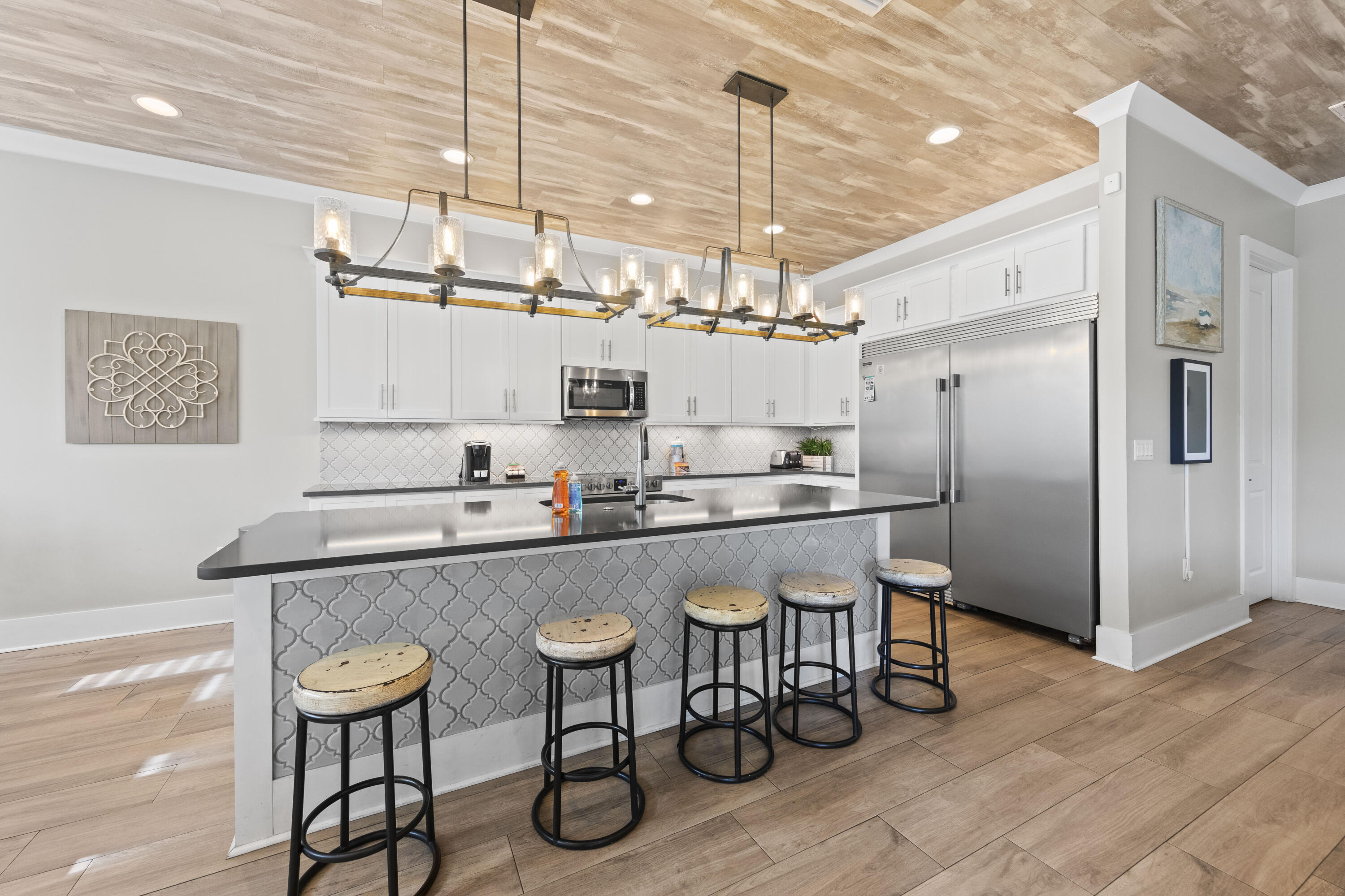 43 Calla Way Miramar Beach, FL 32550 - Photo 13 of 59 a kitchen with kitchen island a dining table chairs stainless steel appliances and cabinets