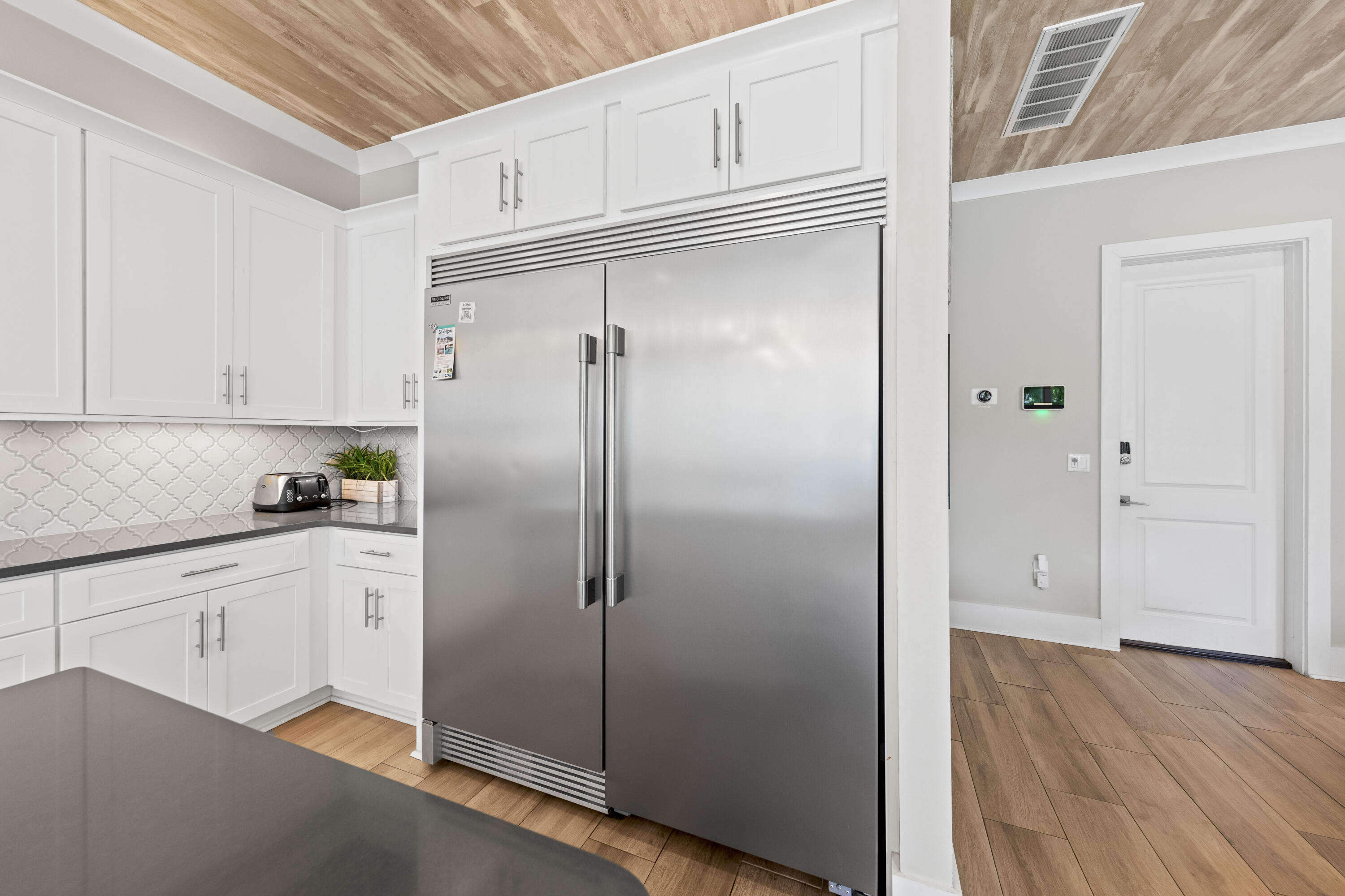 43 Calla Way Miramar Beach, FL 32550 - Photo 14 of 59 a kitchen with a refrigerator a sink and cabinets