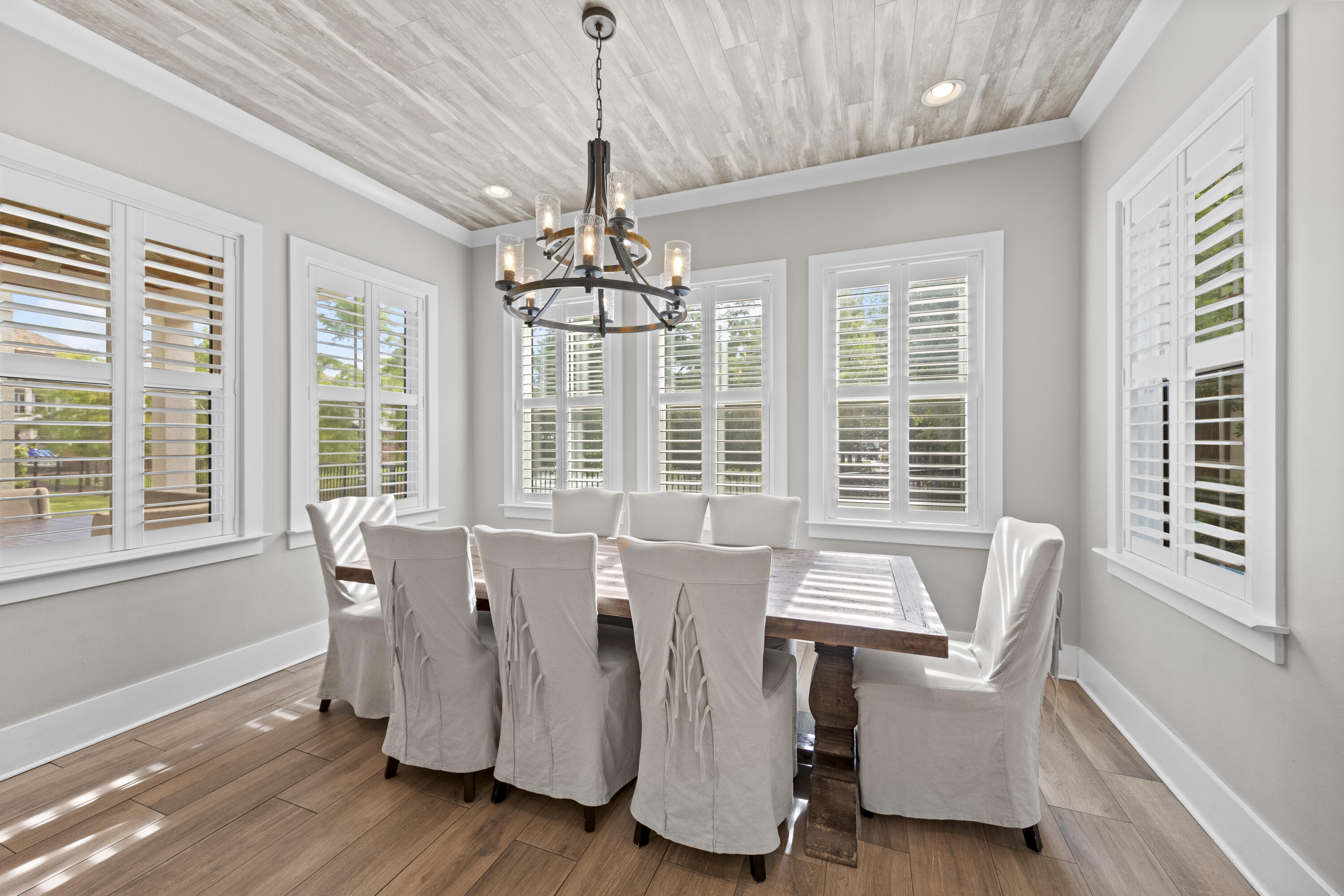 43 Calla Way Miramar Beach, FL 32550 - Photo 16 of 59 a view of a dining room with furniture wooden floor and chandelier