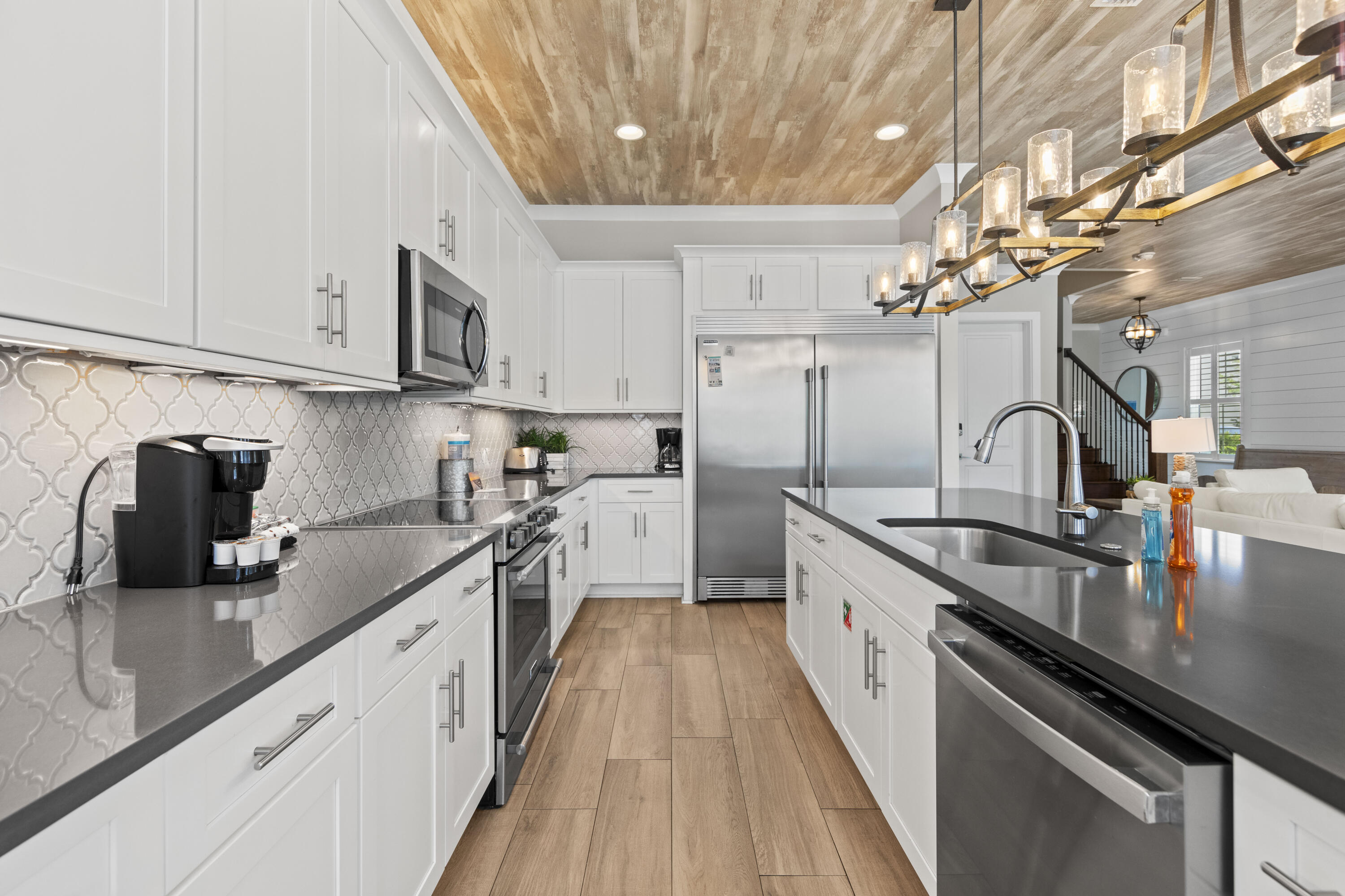43 Calla Way Miramar Beach, FL 32550 - Photo 17 of 59 a kitchen with granite countertop a sink stove and cabinets