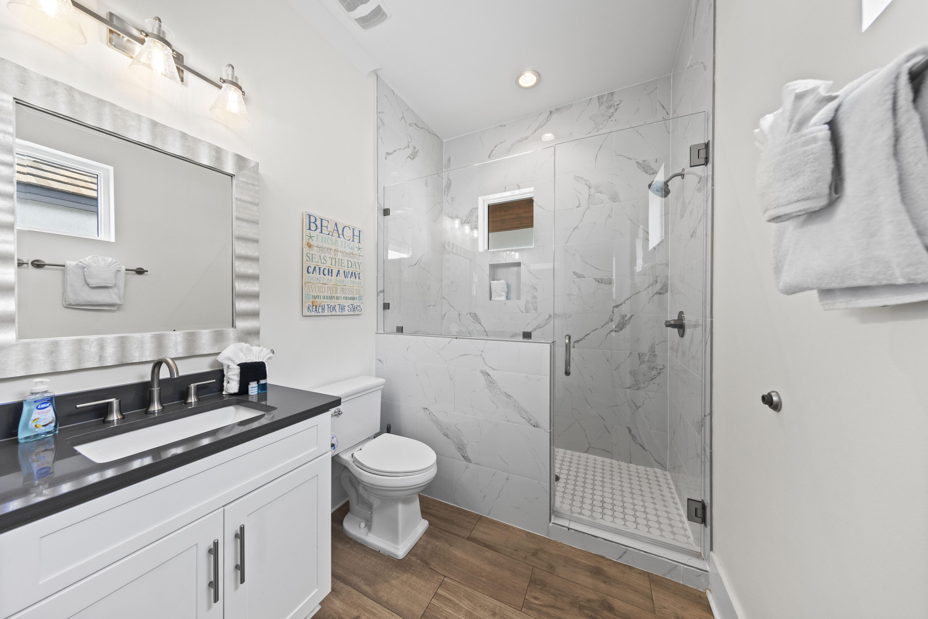 43 Calla Way Miramar Beach, FL 32550 - Photo 43 of 59 a bathroom with a double vanity sink toilet and shower