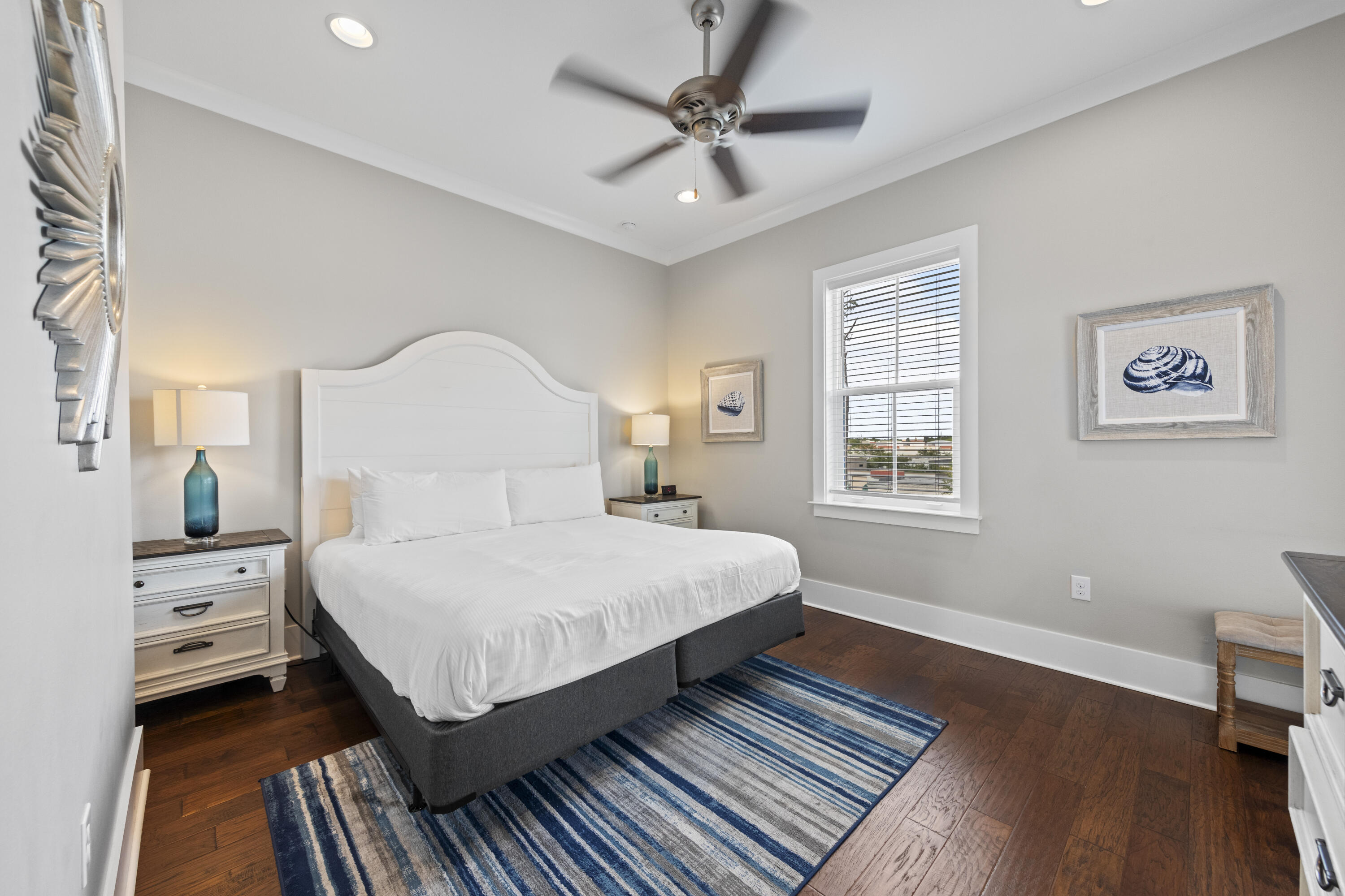 43 Calla Way Miramar Beach, FL 32550 - Photo 44 of 59 a bedroom with a large bed wooden floor and window