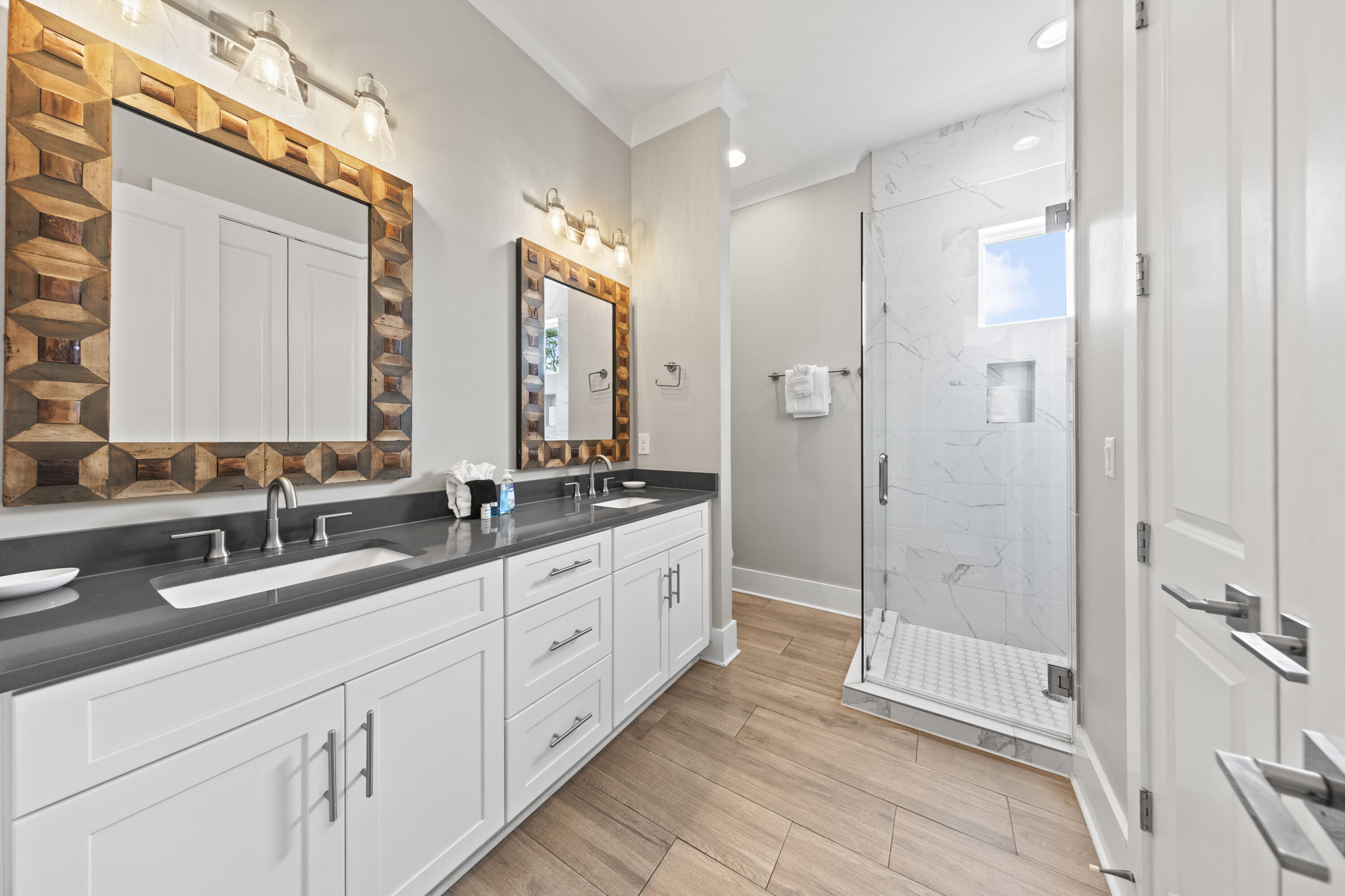 43 Calla Way Miramar Beach, FL 32550 - Photo 50 of 59 a spacious bathroom with double vanity and mirrors