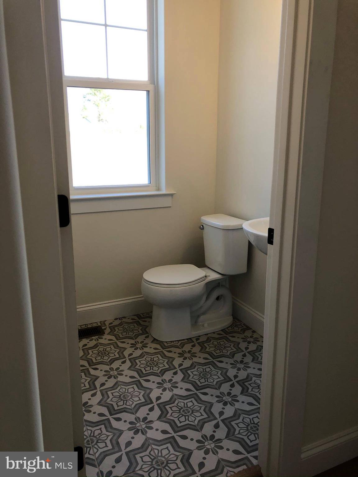 2825 Egypt Road Audubon, PA 19403 - Photo 11 of 41 a bathroom with a toilet and a window