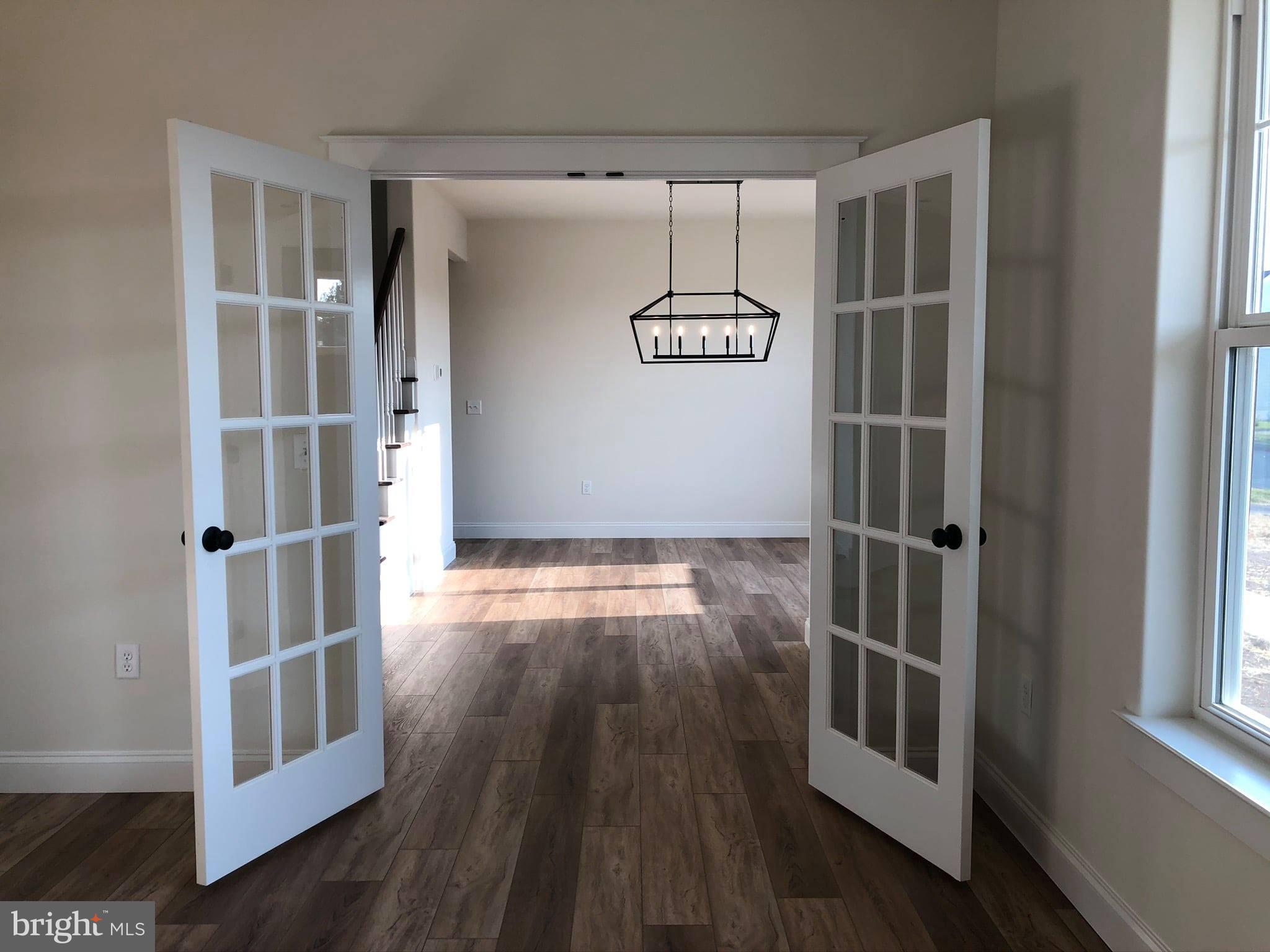 2825 Egypt Road Audubon, PA 19403 - Photo 18 of 41 an empty room with wooden floor and windows