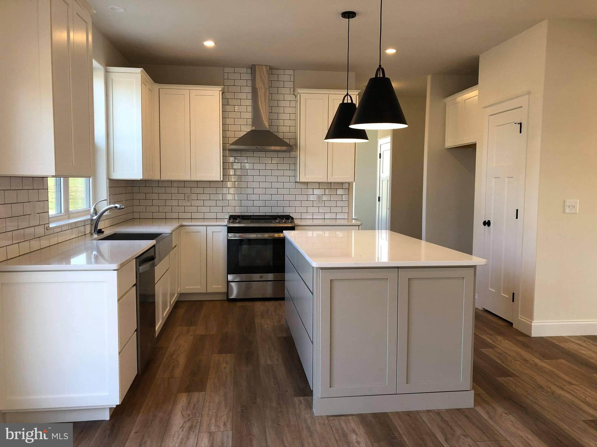 2825 Egypt Road Audubon, PA 19403 - Photo 2 of 41 a kitchen with a sink stove and cabinets