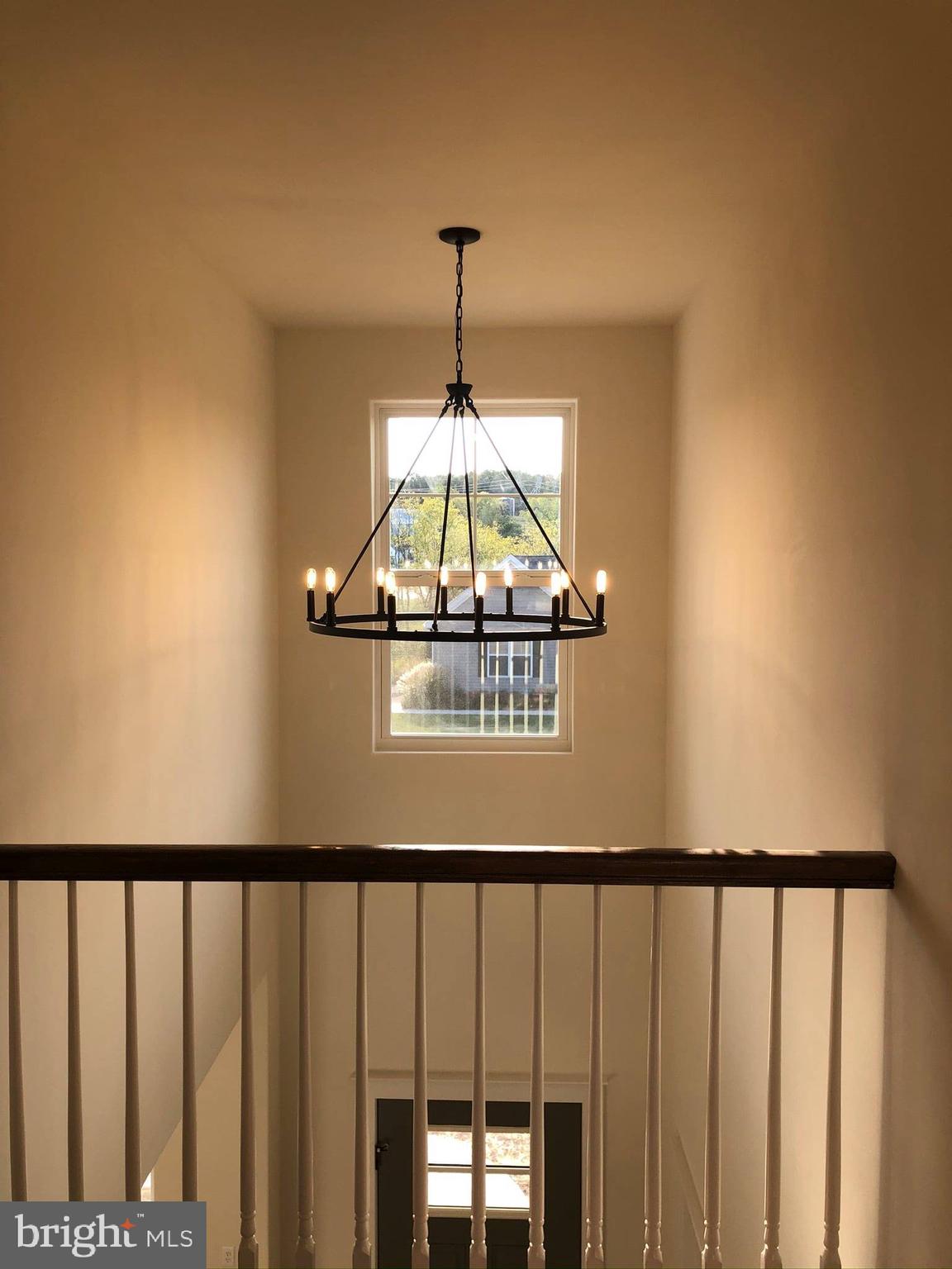 2825 Egypt Road Audubon, PA 19403 - Photo 22 of 41 a view of a hallway with wooden floor and a chandelier