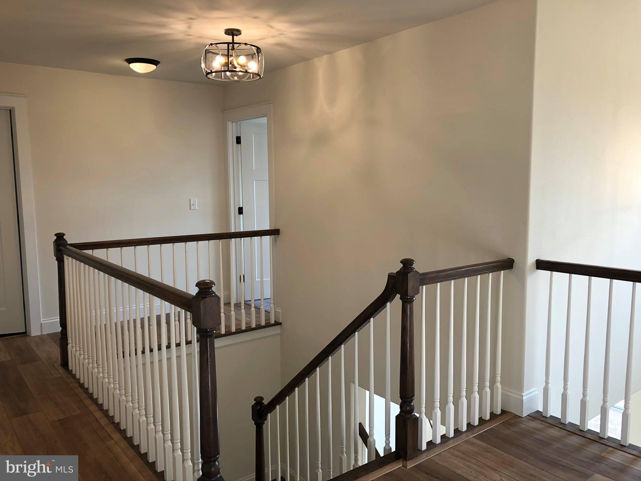 2825 Egypt Road Audubon, PA 19403 - Photo 23 of 41 a view of staircase with railing and a chandelier