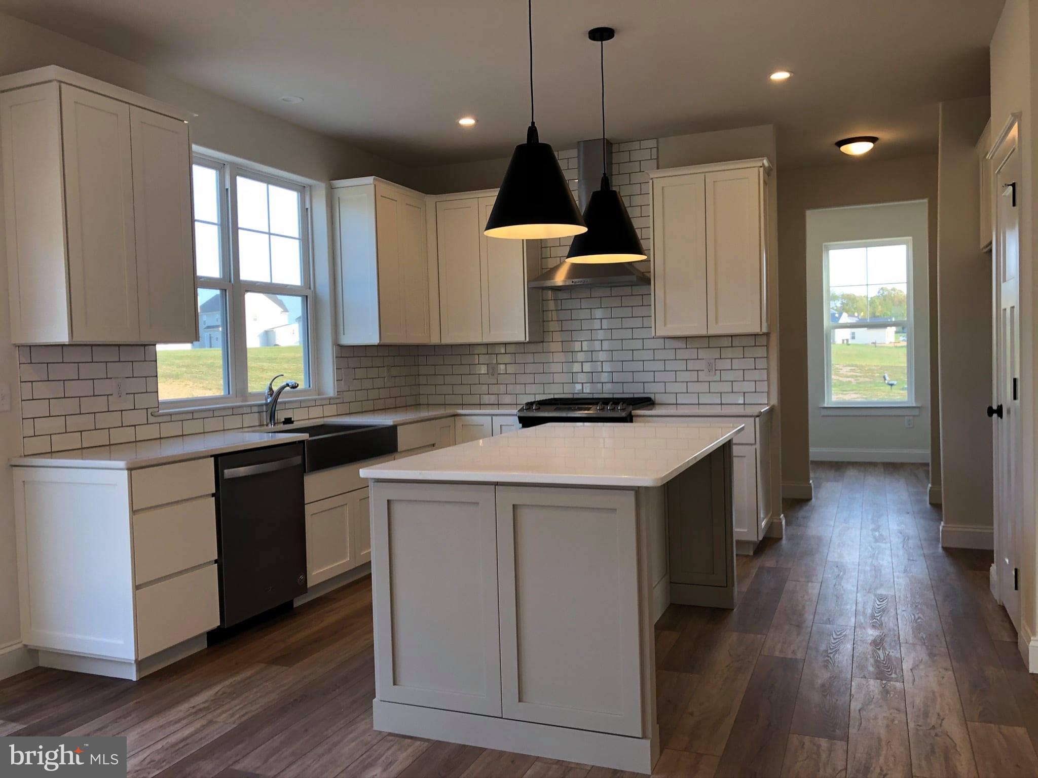 2825 Egypt Road Audubon, PA 19403 - Photo 4 of 41 a kitchen that has a lot of cabinets in it and wooden floors