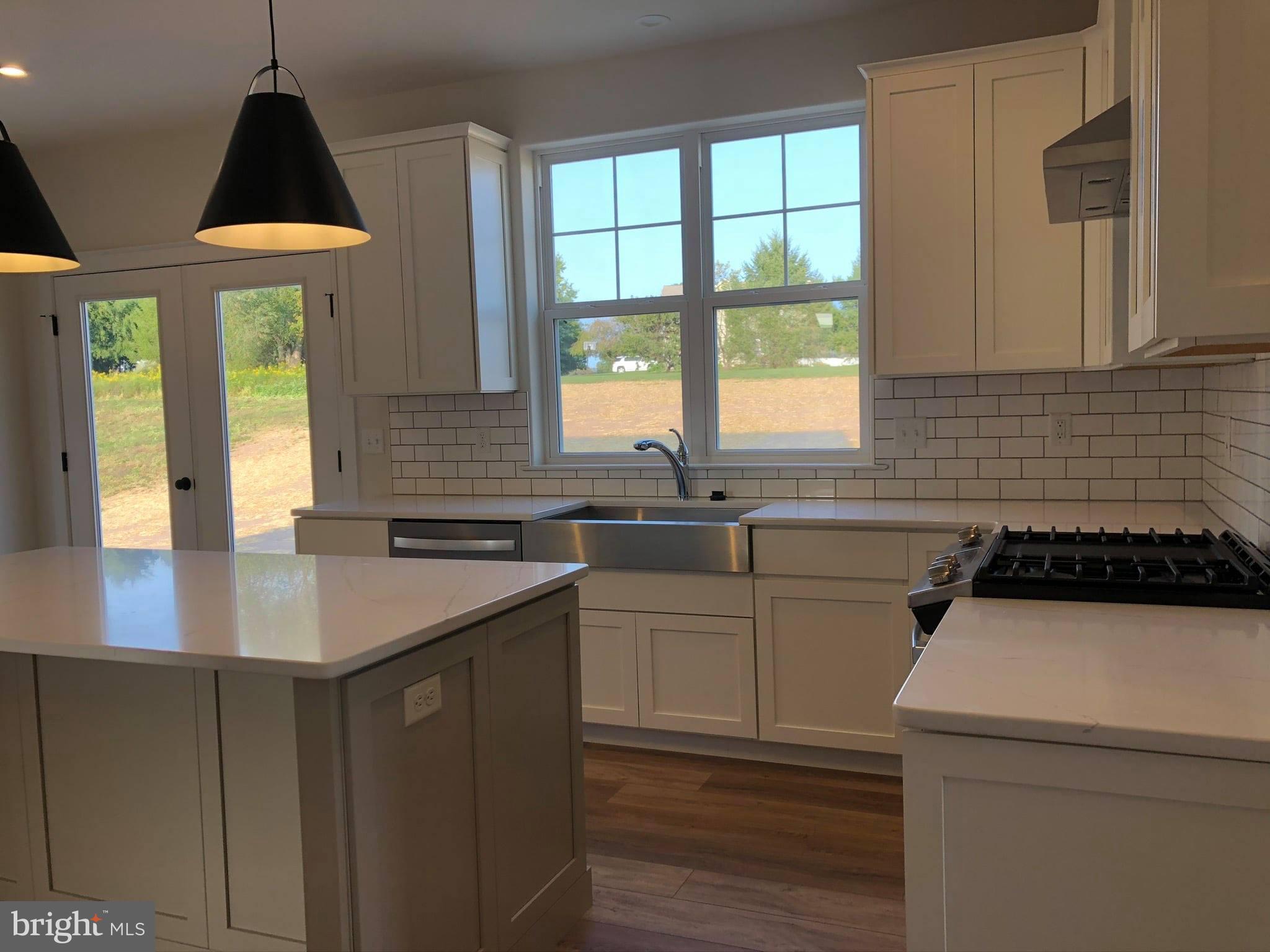 2825 Egypt Road Audubon, PA 19403 - Photo 6 of 41 a kitchen that has a sink a stove and a window