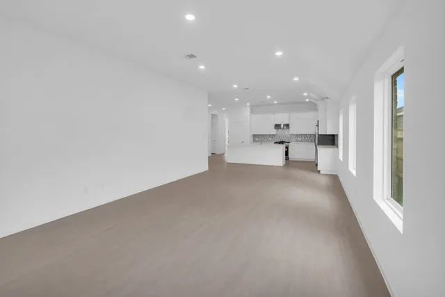 a view of a kitchen with a sink and cabinets