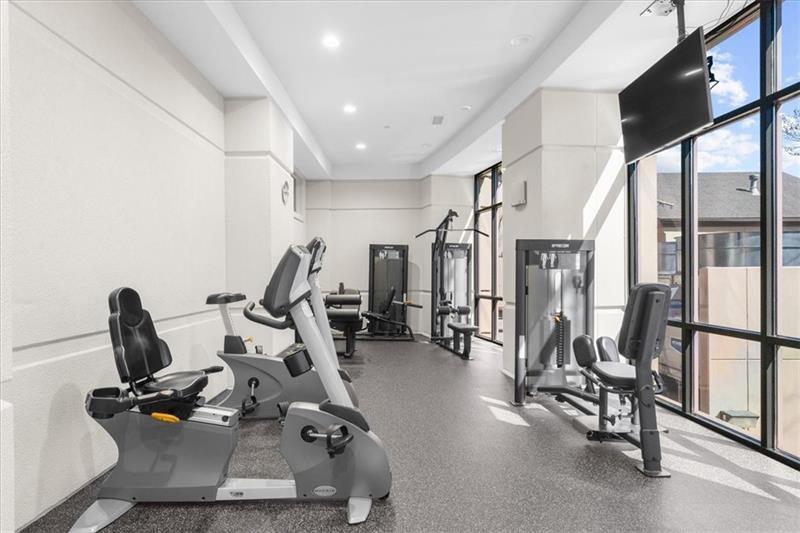 3475 Oak Valley Road Northeast, Unit 410 Atlanta, GA 30326 - Photo 30 of 36 a view of a room with gym equipment
