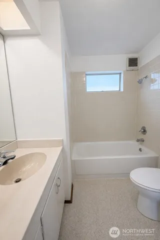 a bathroom with a sink a toilet and a bathtub