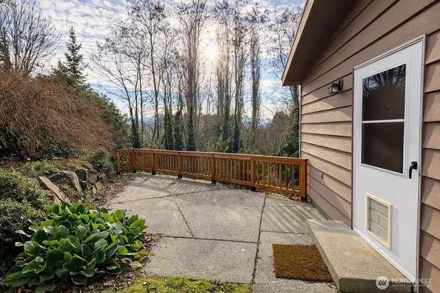 a view of balcony with wooden floor and fence
