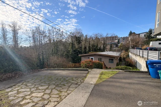 a view of a street with a house