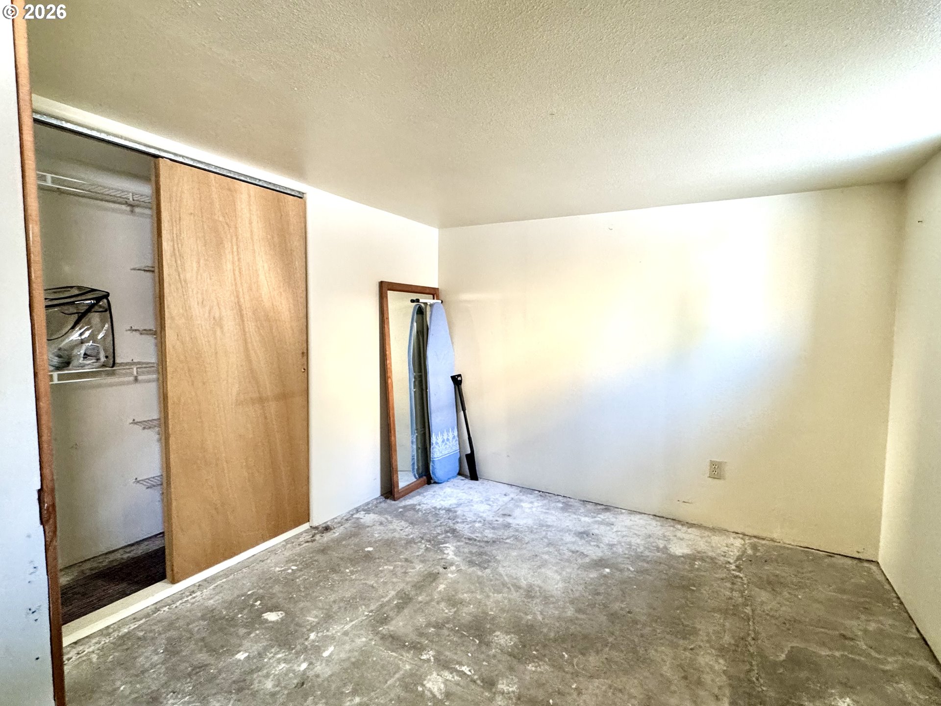 2243 3rd Street Baker City, OR 97814 - Photo 12 of 20 a view of a big room with closet and wooden floor