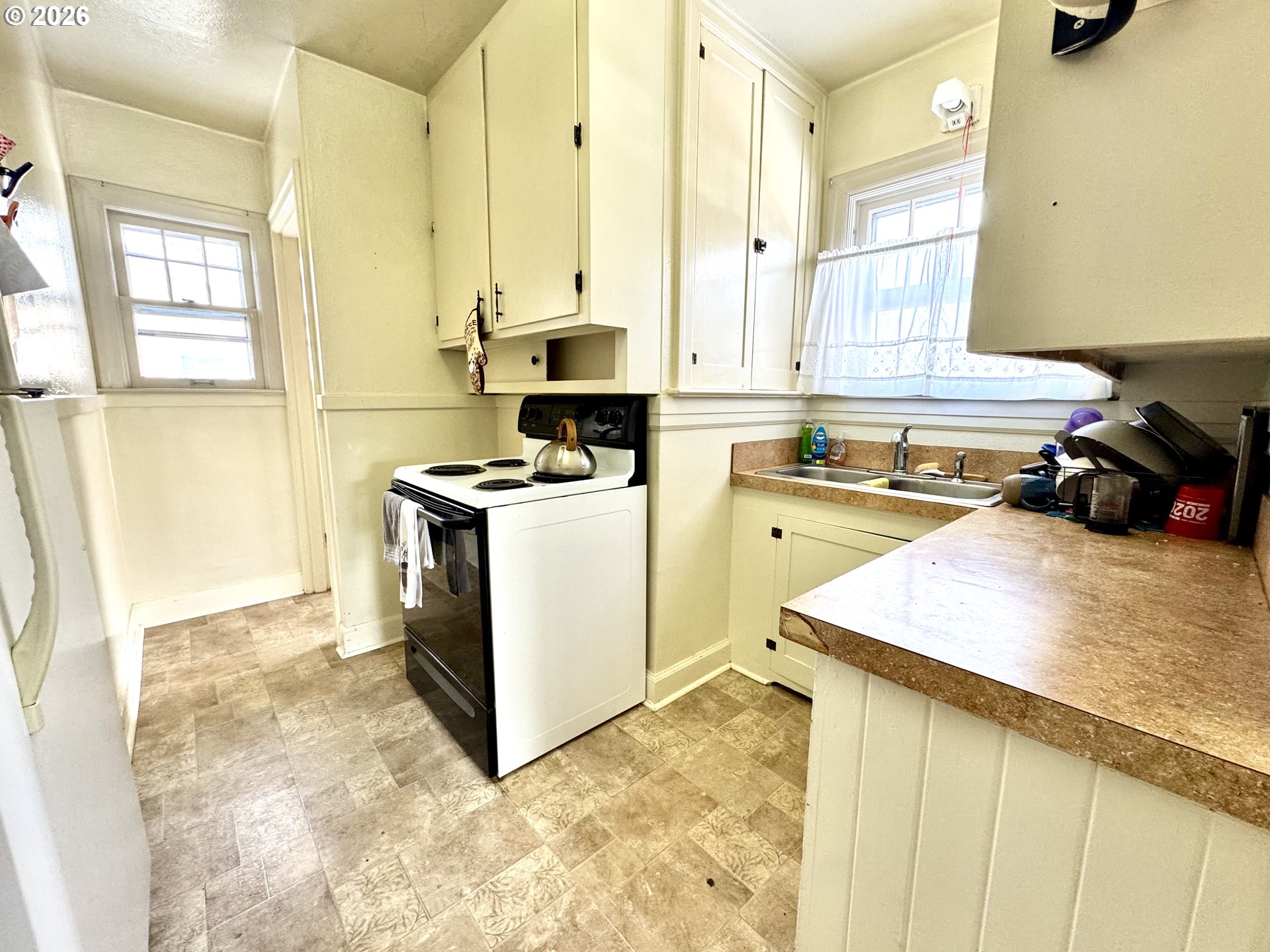2243 3rd Street Baker City, OR 97814 - Photo 2 of 20 a kitchen that has a sink and a stove in it