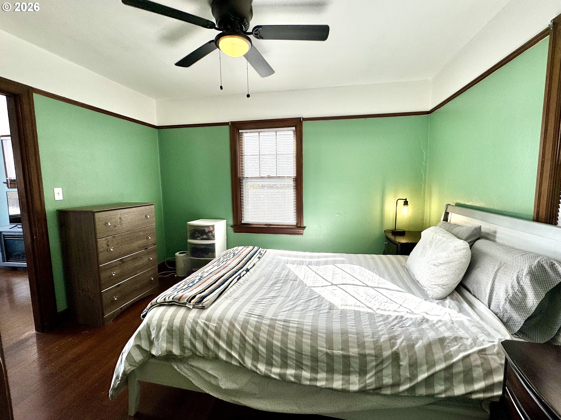 2243 3rd Street Baker City, OR 97814 - Photo 8 of 20 a bedroom with a bed and a chandelier