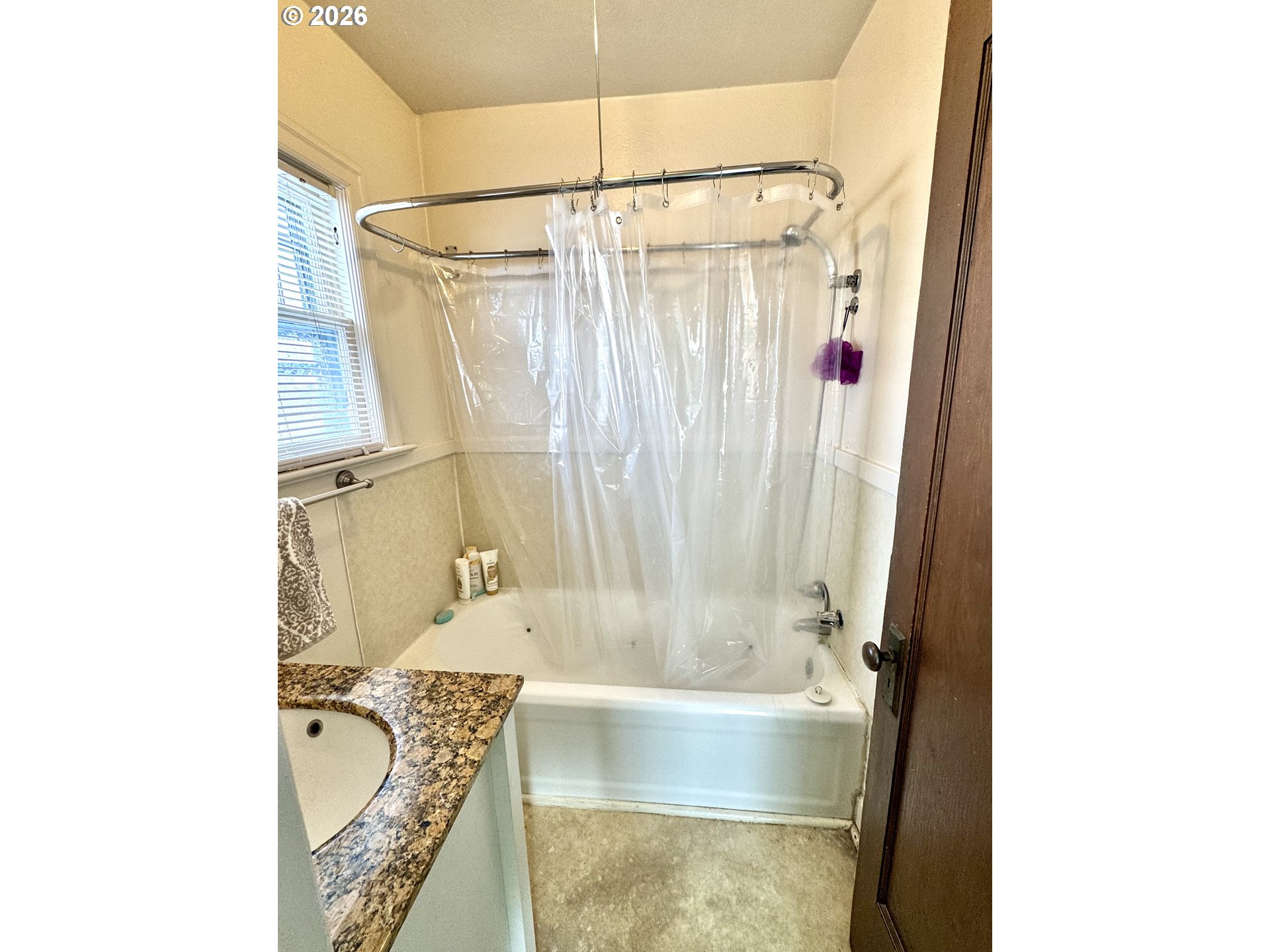 2243 3rd Street Baker City, OR 97814 - Photo 10 of 20 a bathroom with a tub and shower