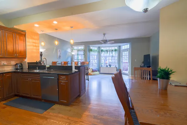a large kitchen with lots of counter space a sink and appliances